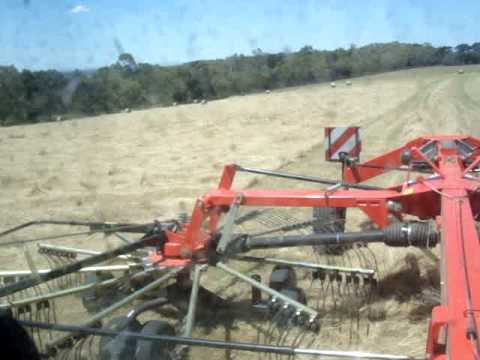Hay baling.. Raking with fella twin rotor. - YouTube