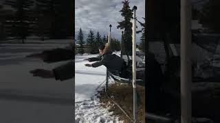 Boy jumps from trampoline and lands in scorpion position