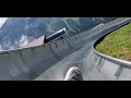 Riding down a mountain slide in Switzerland