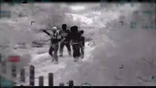 Video shows armed men escorting mother & child across border