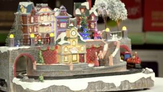 Add an impressive festive flourish to your decorations with this large Christmas village scene complete with LED light accents and a 