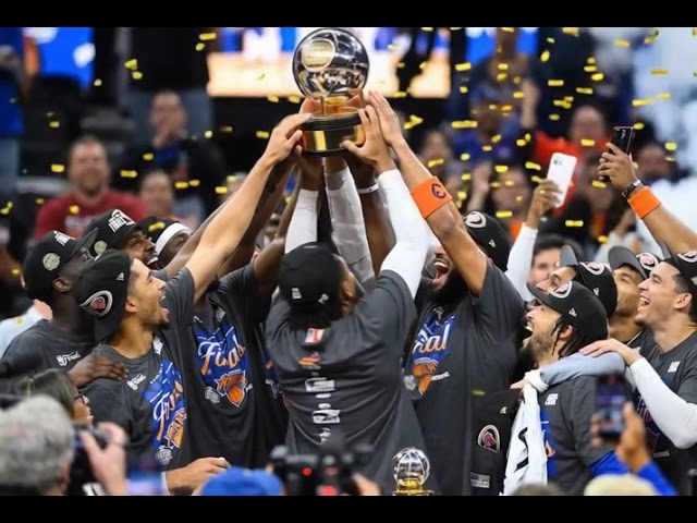 There are NY Knicks basketball players celebrating their victory in the picture