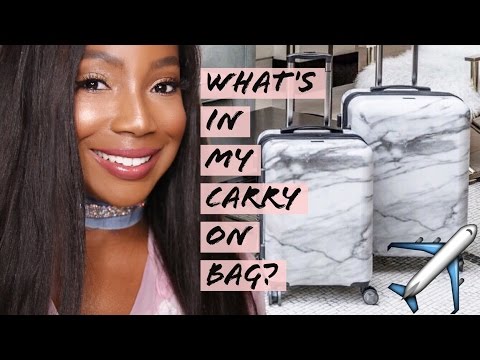 TRAVEL ESSENTIALS: WHATS IN MY CARRY ON BAG? | Whitney Wiley