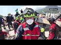 Colombian rescuers lift 11-year-old boy out of the rubble in La Guaira