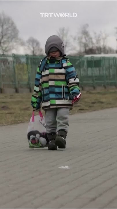 Ukrainian boy cries as he crosses the Poland border