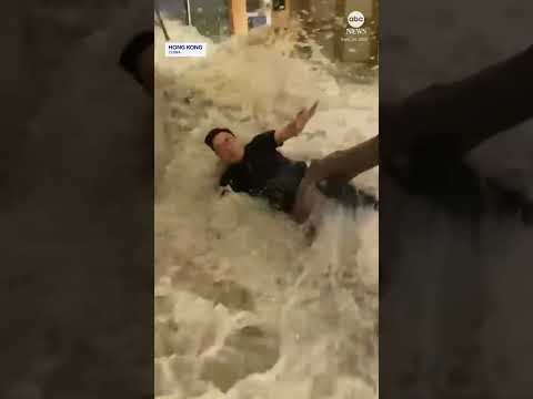 Flood waters crash through hotel doors in Hong Kong