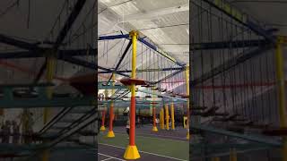Boy ride zipline at amusement park then crashes into mat