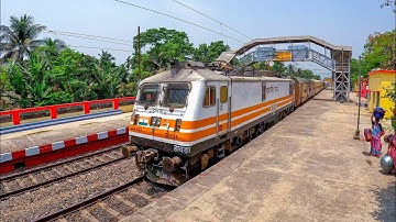 Drone View From Rail Gate High Speedy Express Train Moving out Furiously Through Platform