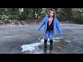 Kid playing and falling on an iced over puddle
