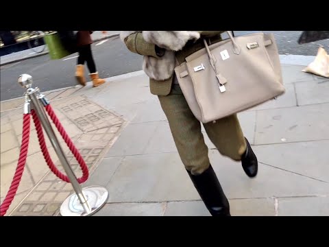 Street fashion in London. What are people wearing in Britain. Ladies and gentlemen.