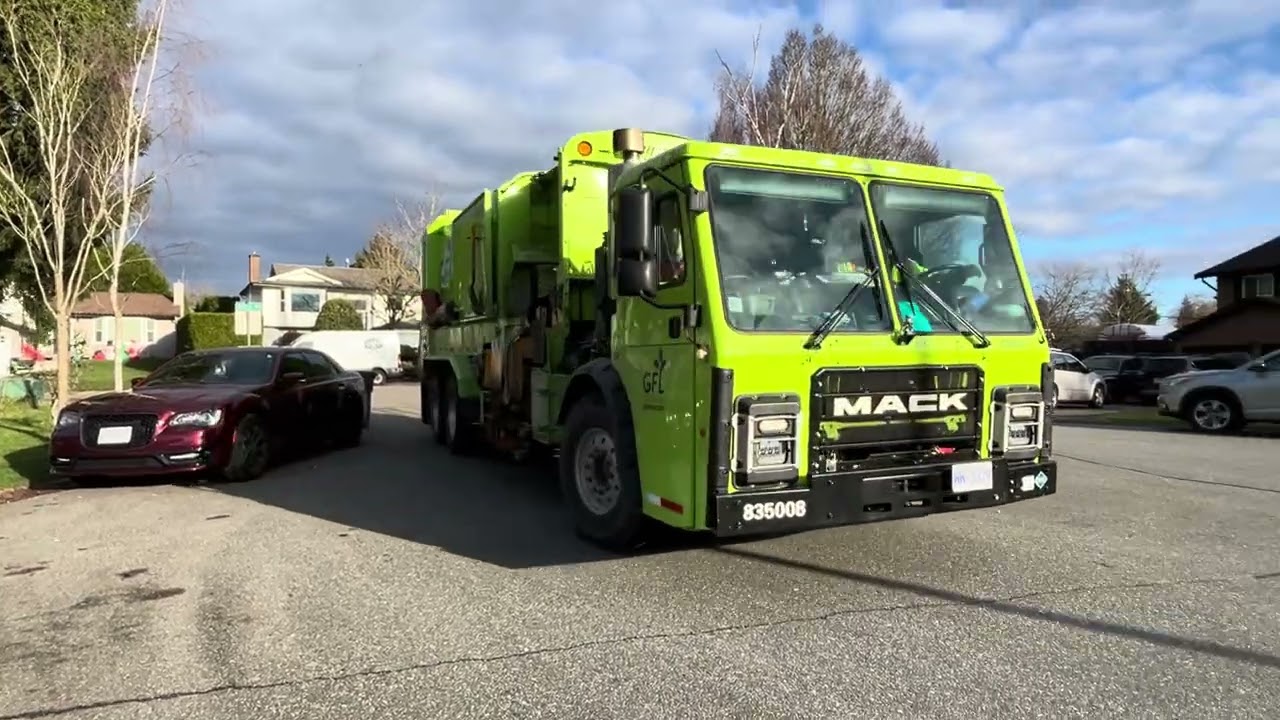 city of surreys GFL Mack LR Helping hand on post x-mas organics.