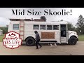 Mid size skoolie tour  young couple converts school bus into off grid tiny home