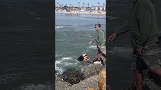 Dramatic video captures hero surf instructor saving drowning girl caught in riptide in California