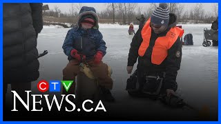 Families try out ice fishing at Fort Whyte Alive