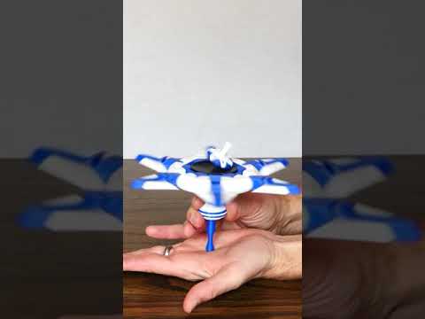 Spinning a Top Within a Top