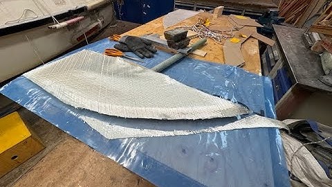 Laminating starbord side of deck house and rudder.