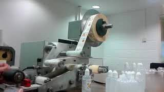 Semi Automatic Labelling of Round Products