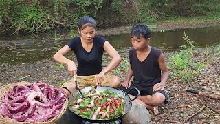 Yummy cook Octopus arm with hot chili for dinner, Survival cooking in forest