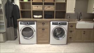 Capri and ivory finish dual laundry mudroom. pull out hamper baskets,
ironing board hidden behind a drawer face, tra...