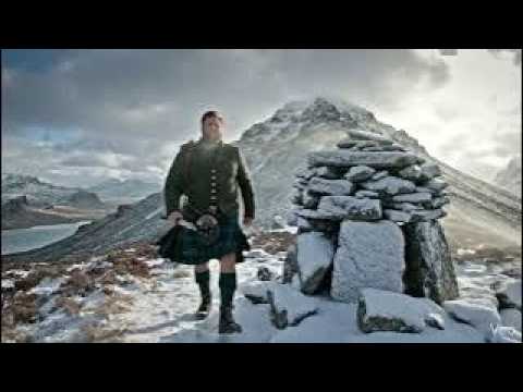 Scotsman Walking Wearing Kilt By Beinn na Caillich Cairn On Winter History Visit To Skye Scotland