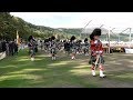 Massed Pipes & Drums return march after the 2018 Ballater Highland Games in Deeside, Scotland