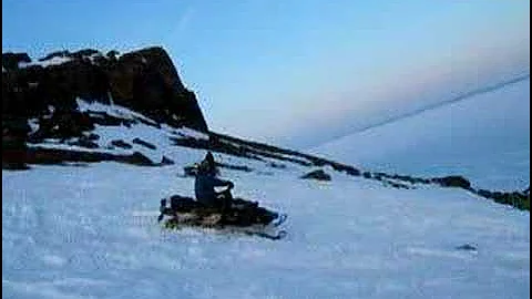 David watching Dean and Ryan hill climbing Near Kugluktuk Nu.