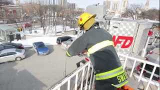 Fire fighters camp out on roof for a cause