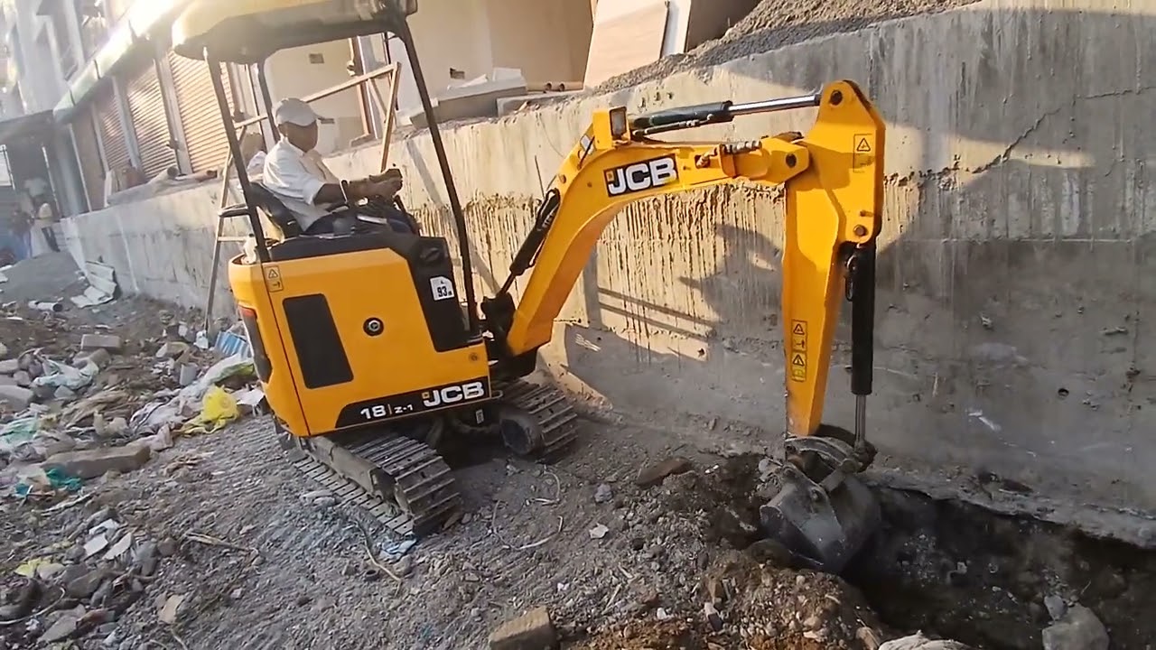 JCB18Z Mini Excavator - Trenching along a building wall @ Pune