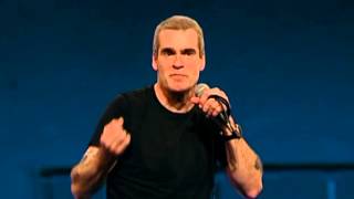 Henry Rollins on a young man standing in the darkness