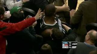 Glen 'Big Baby' Davis crashes into the crowd!