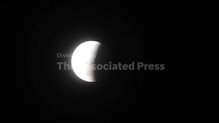 Stargazers gather at Buenos Aires Planetarium to watch the lunar eclipse