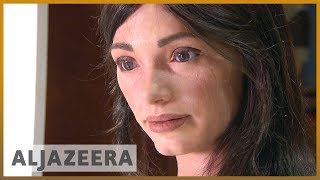 Humanoid robot Aida's drawings on display