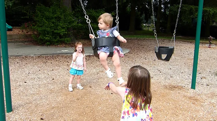07.17.12 Harper Alison Jones being pushed on the swing by Kelsey Jones and Izzy Hartinger