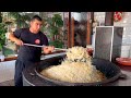 Young cook is preparing Uzbek pilaf in many pots | Pilaf City | Osh city