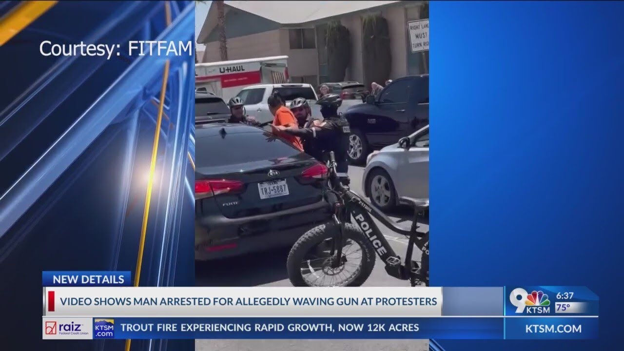 Man arrested for allegedly waving gun at protesters - YouTube
