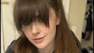Very Pretty Brunette Woman with Long Bangs and Ponytail Wearing a Windbreaker Coat Fan Wind Blowing