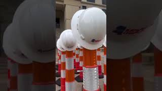 50 hardhats and orange cones represent MDOT workers killed on the job