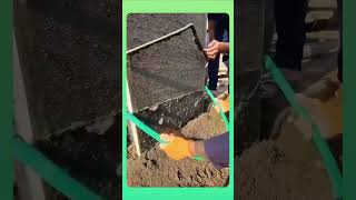 Smoothing fresh concrete onto the wall, building a solid, even surface layer by layer. screenshot 4