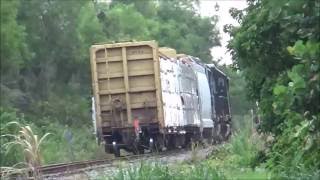 Csx O721-25 with a SD40-2 and conductor getting out of the cab and horn toots