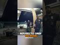 Man keeps his door shut against cops.