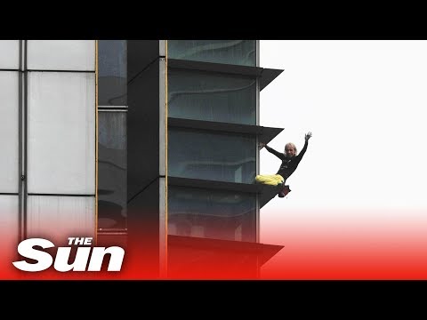 French spiderman free climbs one of Paris' tallest buildings LIVE
