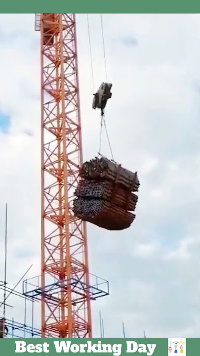 Best working day #1759 A tower crane lifts a bundle of metal pipes