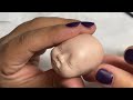 Sculpting a Micro polymer clay baby.