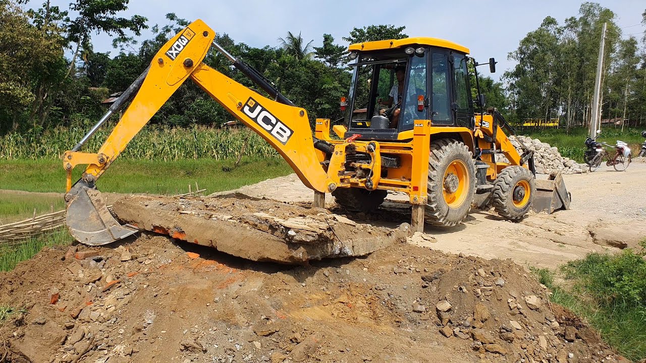 JCB Backhoe Machine Throwing Out Heavy Concrete Slab JCB Widening