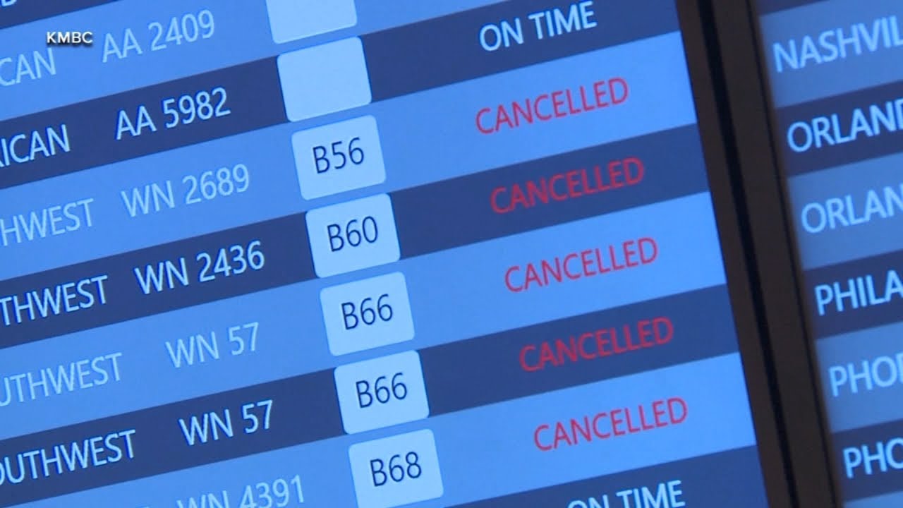 Winter storm forces hundreds of flight cancellations and delays - YouTube