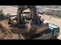 Caterpillar 375 Excavator Loading Trucks