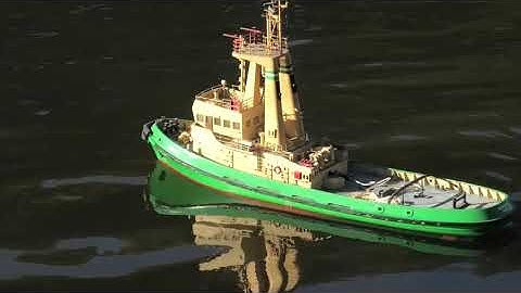 Scratch built RC model of the tug "Burutu" having a run on the pond