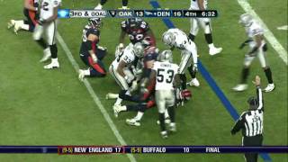 Oakland raiders defensive end tommy kelly holds nothing back on a goal
line stand