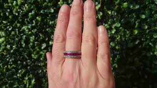 A ruby and diamond half hoop ring