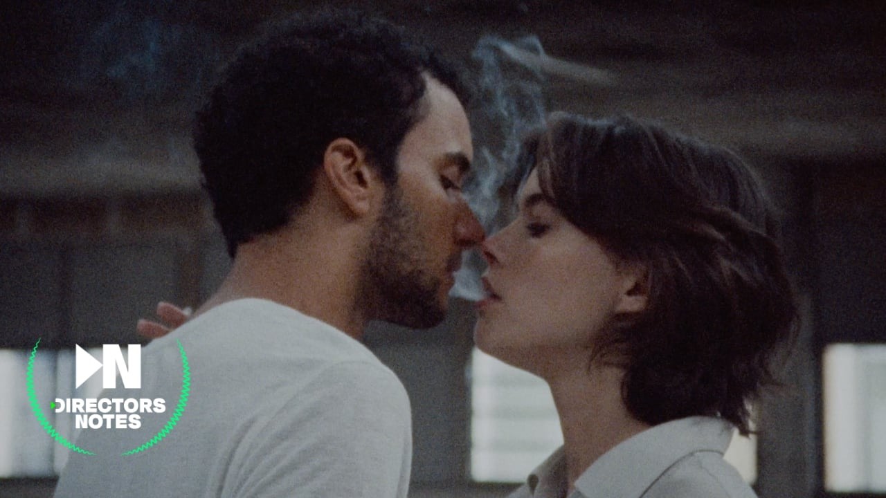 Two dancers share a cigarette in a vast, light-filled former POUSH space, captured on 16mm.